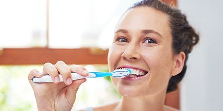 Woman brushing her teeth